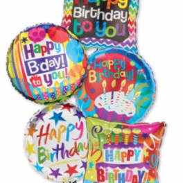 Cluster of colorful birthday balloons with printed messages