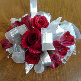 Small bouquet of red roses with silver ribbon accents