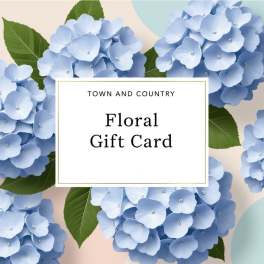 Blue hydrangea blooms around a floral gift card