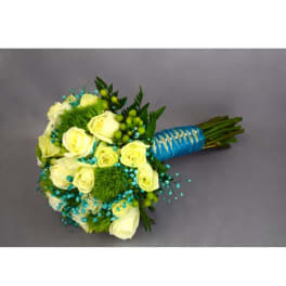 Bouquet of pale yellow roses with blue accents and a wrapped handle