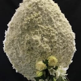 Large white floral spray with small cream roses and lilies