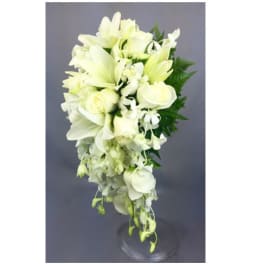 White floral arrangement in a clear glass vase