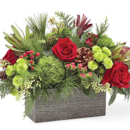 Red roses and green flowers in a rectangular box container