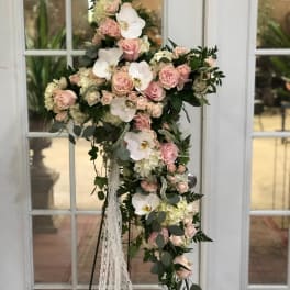 Tall floral standing arrangement with pink roses and white orchids