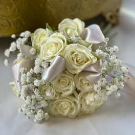 Bouquet of ivory roses with baby's breath and satin ribbon