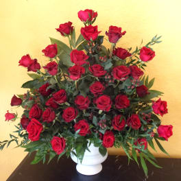 Large bouquet of red roses in a white vase