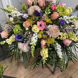 Large mixed floral spray with pink, purple, white, and yellow blooms