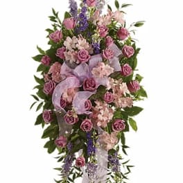 Tall pink and lavender floral standing spray with ribbon
