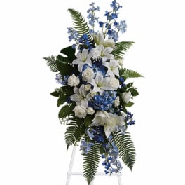Blue and white floral standing spray with lilies and roses