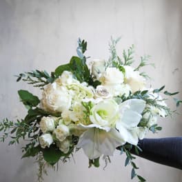 White rose and calla lily bouquet with greenery