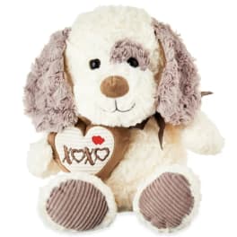 Plush dog holding a heart with XOXO embroidery