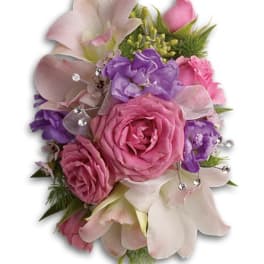 Pink and purple floral bouquet with ribbon accents