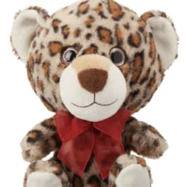 Leopard-print teddy bear with a red ribbon bow