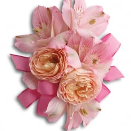 Pink floral corsage with peach roses and alstroemeria on ribbon