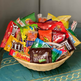 Basket filled with assorted candy bars and snack-size chocolates
