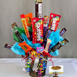Candy bouquet in a black container with colorful ribbons