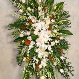 Large white floral standing spray with orchids and roses