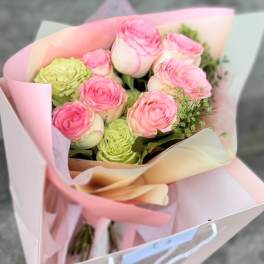 Pink and green rose bouquet wrapped in pastel paper