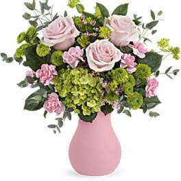 Pink roses and green hydrangeas in a pink vase