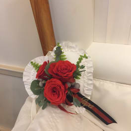 Red rose bouquet with white ruffled wrap and ribbon