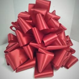 Large red gift bow on a white background