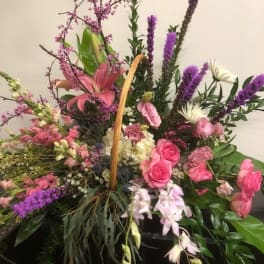 Large mixed floral basket with pink and purple blooms