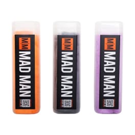 Three labeled bottles of colored powder in orange, black, and purple
