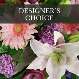 Mixed bouquet with pink gerbera daisies, white lilies, and purple flowers