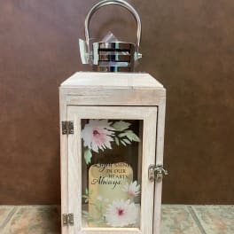 Wooden memorial lantern with floral panel and metal handle