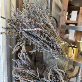Bundles of dried lavender in a metal container
