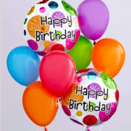 Cluster of colorful birthday balloons with two "Happy Birthday" foil balloons