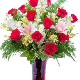 vase of lilies and roses