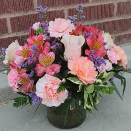 Pink and white mixed bouquet in a glass vase