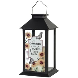 Black lantern with a floral memorial message and butterflies