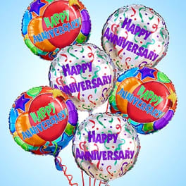 Cluster of colorful anniversary balloons with confetti patterns