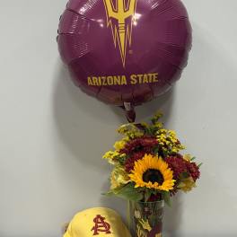 Sunflower bouquet in a glass vase with an Arizona State balloon and yellow cap