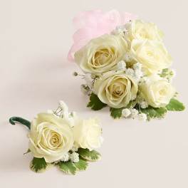 White rose bouquet and matching boutonniere with pink ribbon