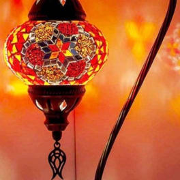 Decorative mosaic table lamp with a curved black stand