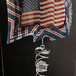 Patriotic hanging ornament with layered American flag panels and crystal beads