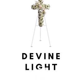 White floral cross on a stand