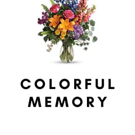 Colorful mixed flower arrangement in a glass vase