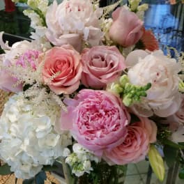 Pink and white mixed bouquet in a clear glass vase
