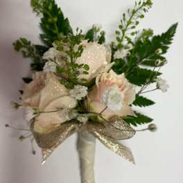 Small blush rose bouquet with white filler flowers and a gold ribbon wrap