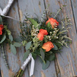Orange rose bouquet with eucalyptus and white filler flowers