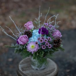 Lavender and purple bouquet in a clear glass vase