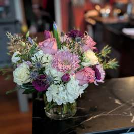 Mixed pink and white bouquet in a clear glass vase