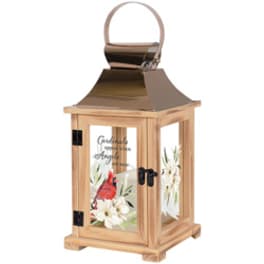 Wooden lantern with a cardinal and white flowers on the glass panels