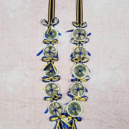 Blue and yellow ribbon garland made with folded dollar bills