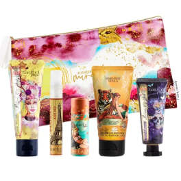 Assorted Barefoot Venus body care tubes and a pouch on a white background
