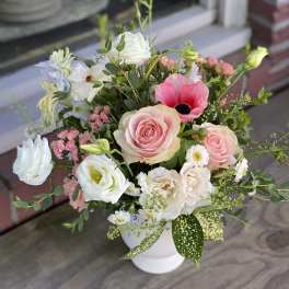 Pink and white mixed bouquet in a white vase